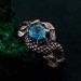Azure Coil: Gothic Snake Ring with Blue Topaz