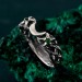 Gothic Silver Ring with Emerald and Radiant Motif