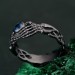 Celtic Knot Blue Topaz Fantasy Ring with Skeleton Hand Design - Gothic Engagement Jewelry
