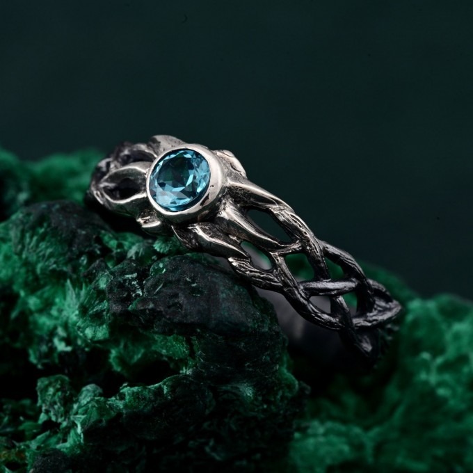 Waves of Serenity: Gothic Blue Topaz Ring