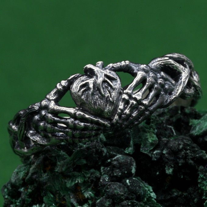 Grasp of the Heart: Gothic Skeleton Hands Ring
