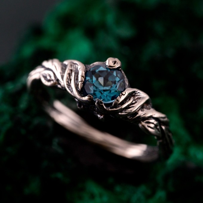 Gothic Silver Ring with Sapphire and Flowing Design