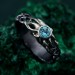 Waves of Serenity: Gothic Blue Topaz Ring