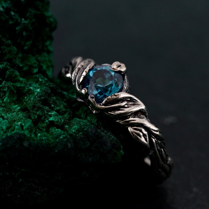 Gothic Silver Ring with Sapphire and Flowing Design