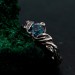 Gothic Silver Ring with Sapphire and Flowing Design
