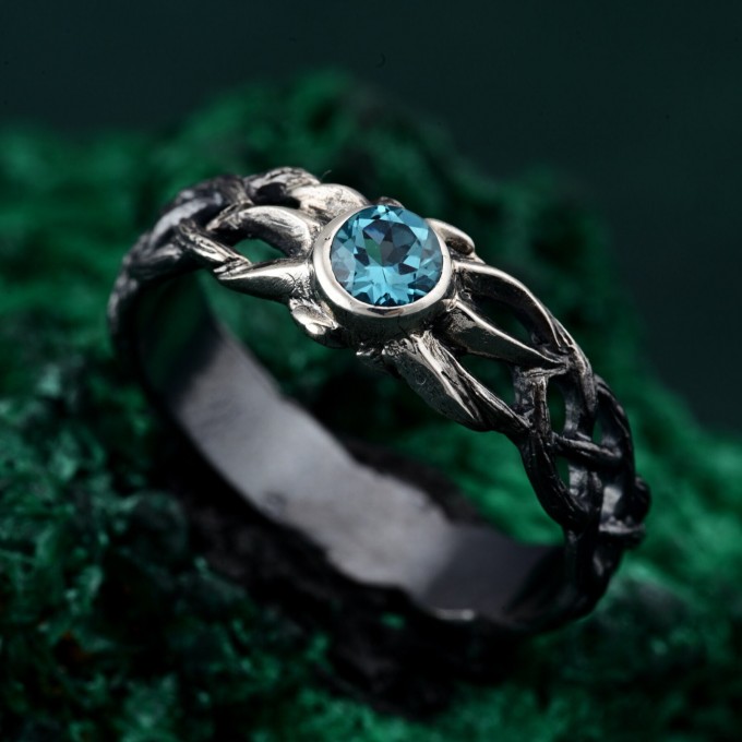 Waves of Serenity: Gothic Blue Topaz Ring